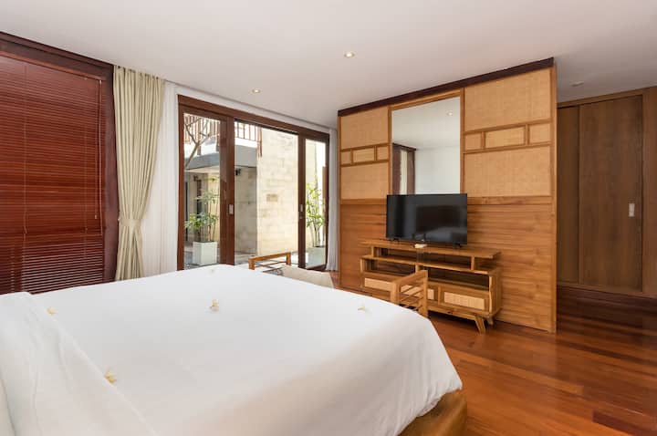 Bedroom 2 is on the first floor, with en-suited bathroom, TV and a comfortable coach. 