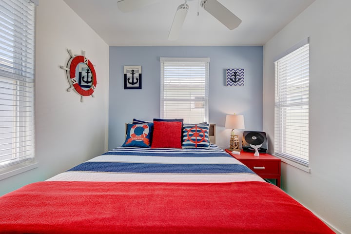 Queen bedroom with 40” SMART TV.  This bedroom is right at the top of the stairs and next to the bathroom.  We have extra charger outlets to support your devices as well as a small fan in every room. 