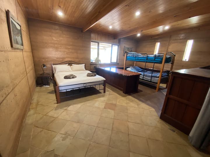 Bedroom two with a queen size bed and kids bunk bed.