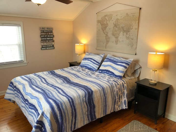 The second bedroom offers a queen sized brand new mattress and a peekaboo view of the lake.