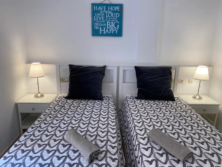 Twin beds in the second bedroom.