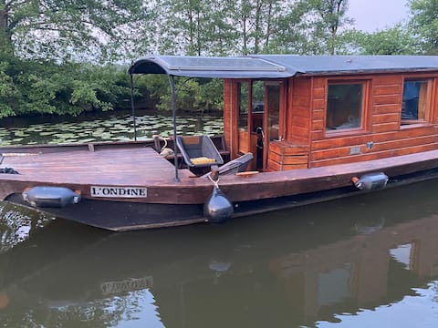 Traditional wooden boat. + electric boat