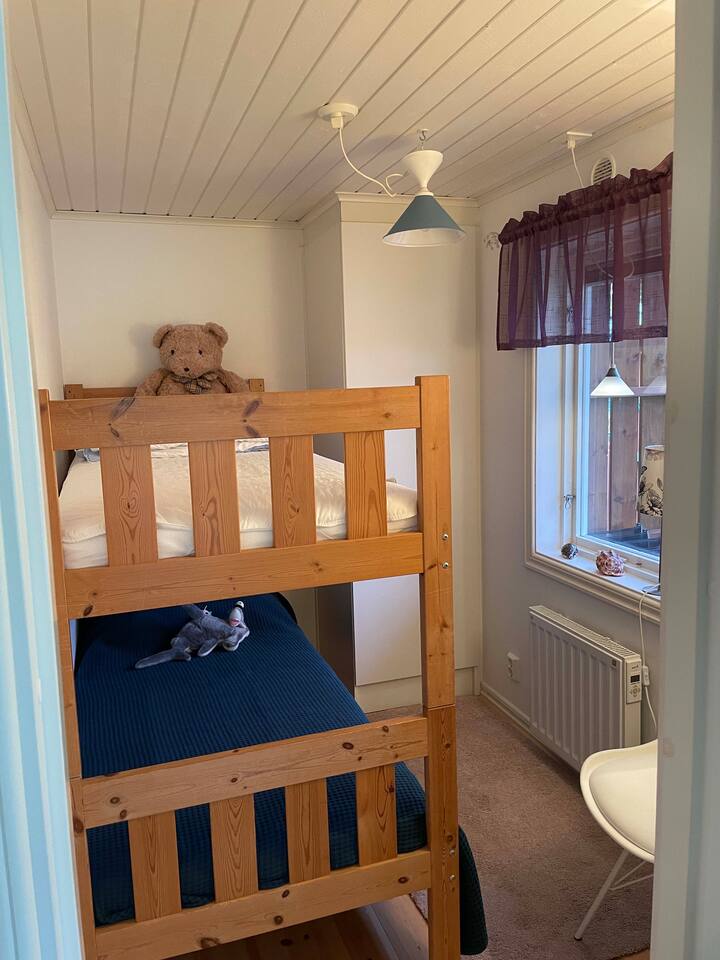 Bedroom with bunk bed. There are also children's books for nice fairytale moments.
