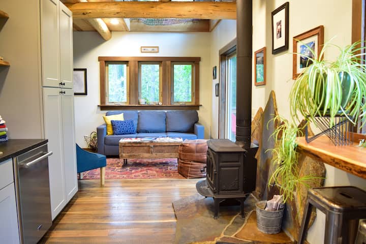 Cozy Living Room - Couch folds out to a Queen Size Bed and there are several board games located in the coffee table