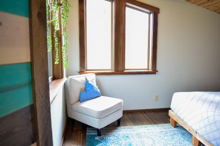 Peeking into the Master bedroom located behind custom made saloon style doors