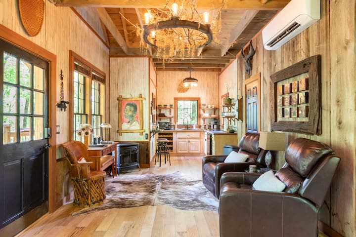 Beauty, design and light combine to create a tranquil, cozy space. Sapele trim adorns six-foot windows and the Queen Murphy bed on the far wall. There’s comfy seating and a cherry desk for working and bird-watching; heat, air, Wi-Fi and Roku TV.