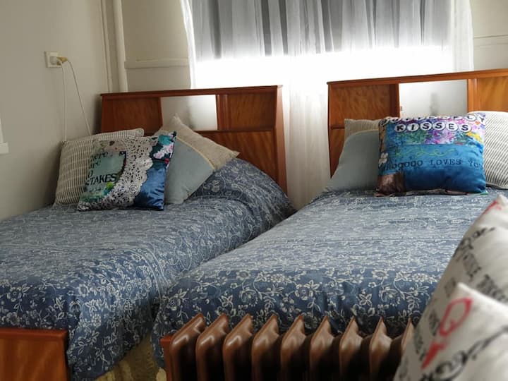 Sunroom with twin single beds.
