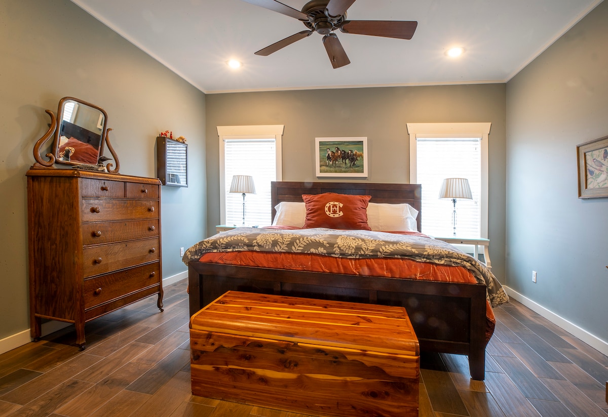 Bedroom has a king-size bed, multiple charging port station for most portable devices bedside