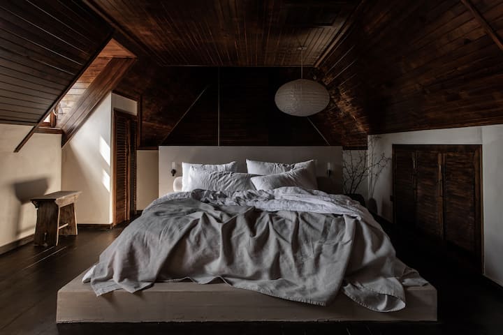Master suite.  A generous mezzanine is dedicated to the master bedroom featuring a king size bed, our very own SABI Sleep linen and Onsen.