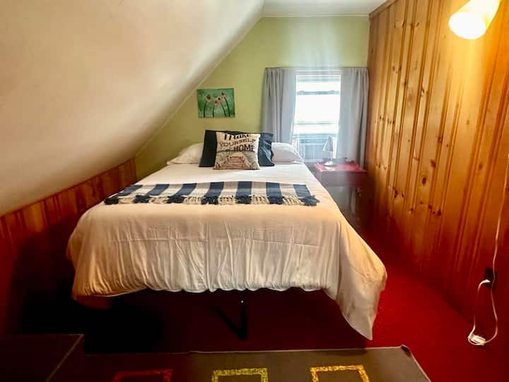 loft bedroom with double bed and twin floor mattress in the closet (can sleep up to 3)