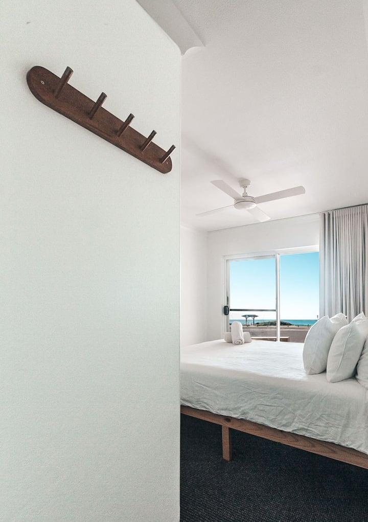 Master Bedroom with own glass sliding door leading to patio / beach.