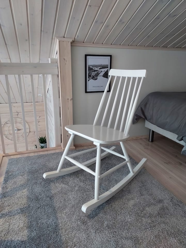 The loft has a rocking chair.