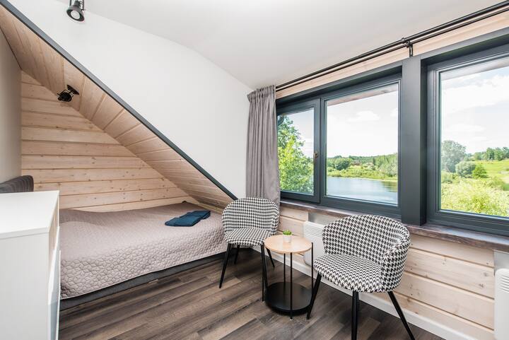Master bedroom with sofa bed, lake view