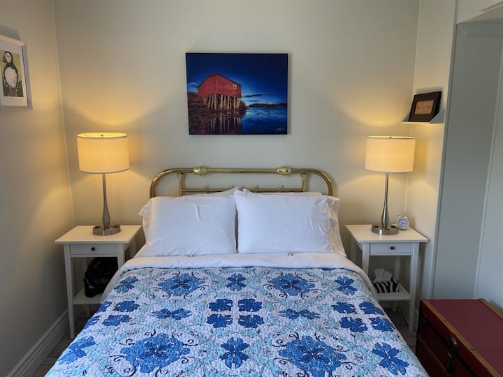 The second bedroom comes with double bed, quality linens, room-darkening blinds, and harbour views.