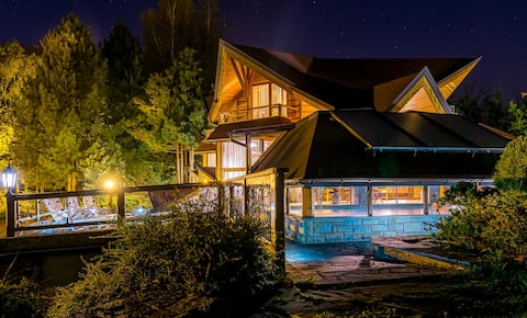 Wooden cottage in the mountains with a pool and sauna