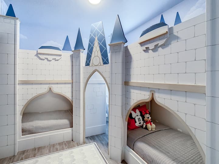 The castle bed sleeps 4 with twin over twin bunk beds as well as cubby storage shelves.