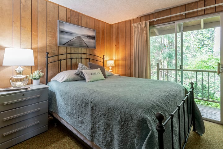 main floor Queen bedroom with direct access onto the expansive deck