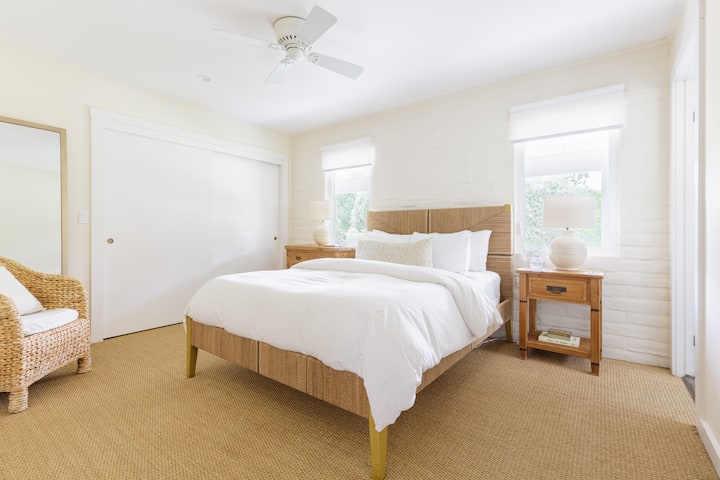 Peaceful primary suite with queen bed and ensuite bath. Features 100% cotton sheets, fluffy duvet, full-length mirror, WiFi charging station, spa robes, hoodies, hotel style safe for your valuables, and plenty of closet space for your belongings.