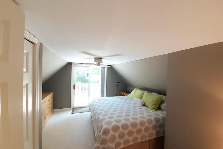 Bedroom #1 - King sized bed, roof top deck with lake views. Dream Works Sleep by Number Mattress with separate controls for each side.  Mini Split HVAC heating and cooling.  Ceiling Fan. Black-Out sliding curtains for patio door.