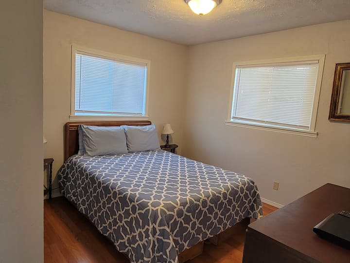 Queen Bed with pillow top mattress. Small closet to hang your clothes while you stay.