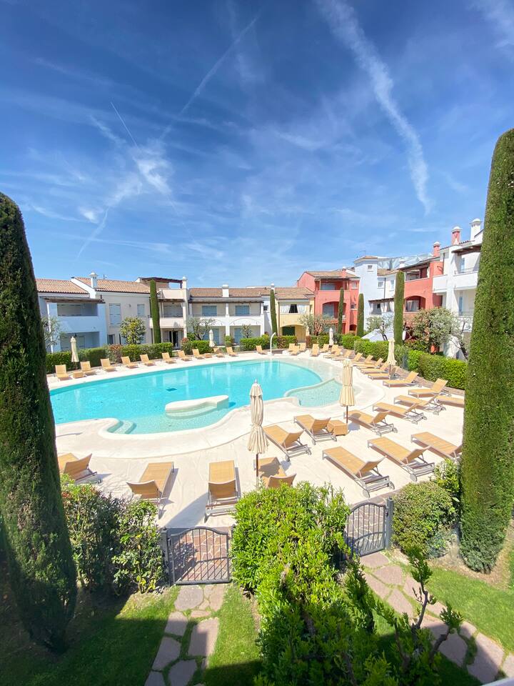Apartment with pool and white sand Condominiums for Rent in Lido di