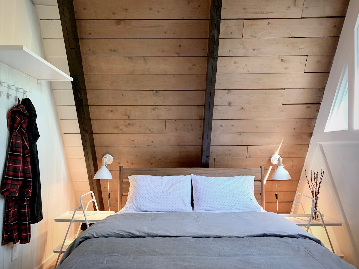  The double height bedroom is at the peak of the "A" with a cozy queen bed.