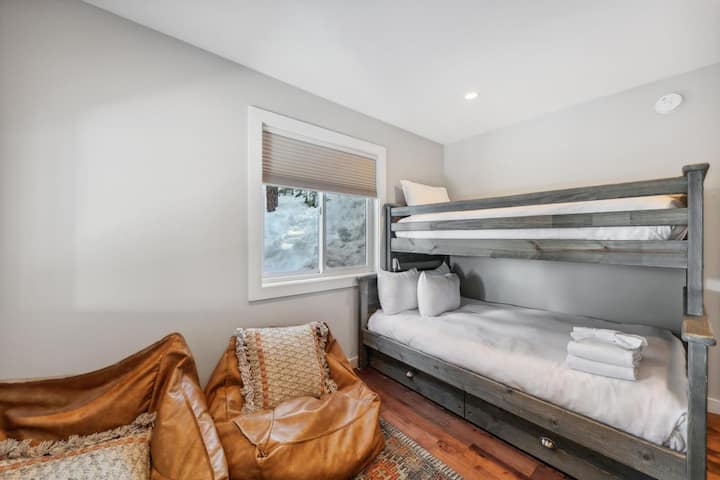 Bunk room! TV with a couple bean bag chairs, and a trundle bed under the twin over full bunk for extra sleeping.