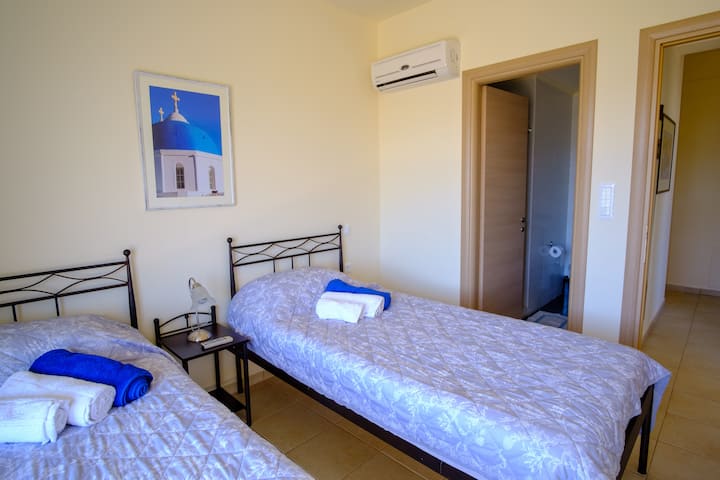 Bedroom 1 with an ensuite bathroom that includes a walk-in shower, WC and sink.  