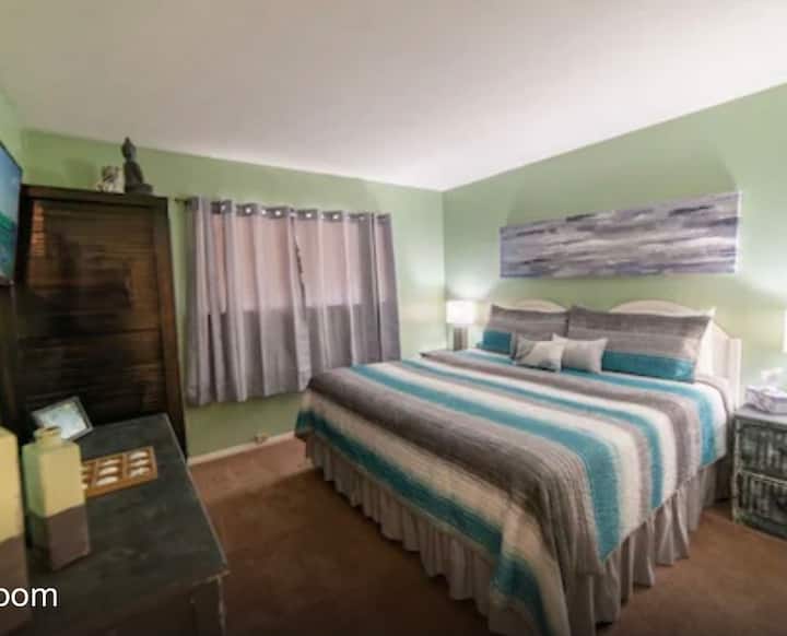 King Size bed in the Master bedroom with a TV