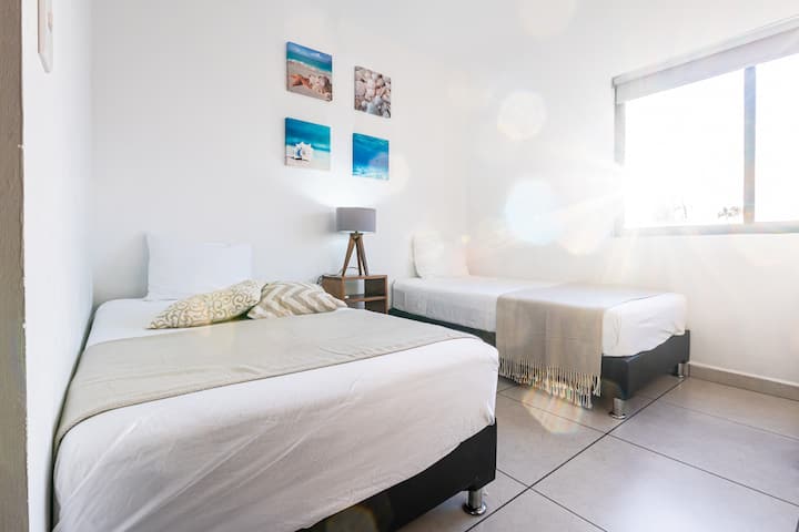Bedroom with single beds, dresser for your clothes