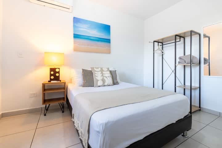 Rest in privacy in our master bedroom with bathroom and double bed with dresser
