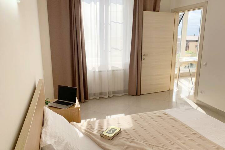 Bedroom with combined bathroom