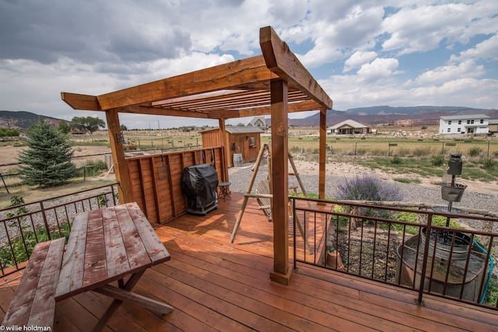 Pergola and barbecue with picnic table.