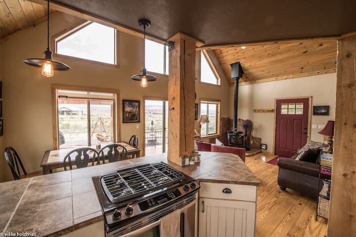 From kitchen. Notice board games and sliding doors to deck.