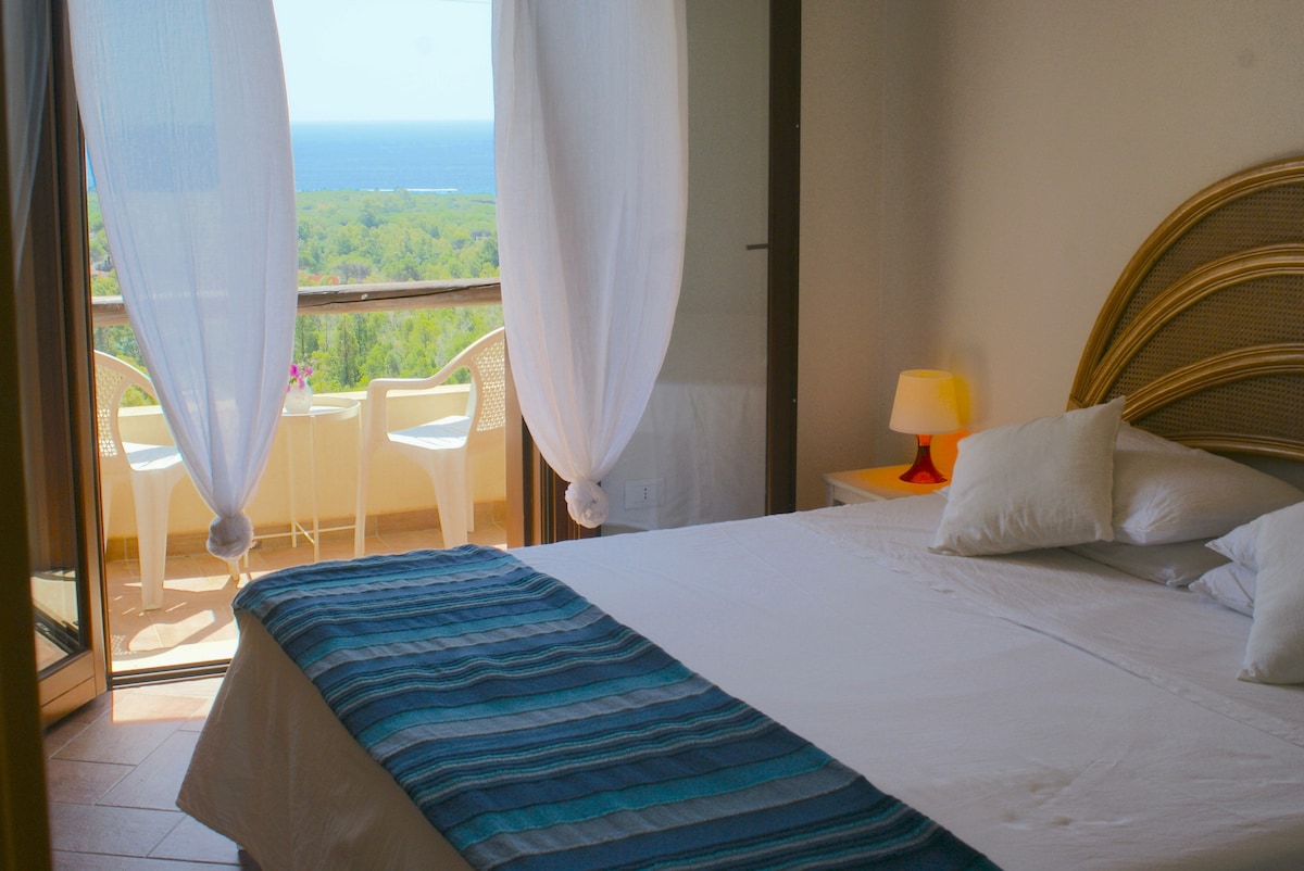 master bedroom  (upstairs) with balcony and seaview