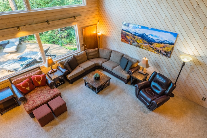 View of the living area and outside deck from the second floor