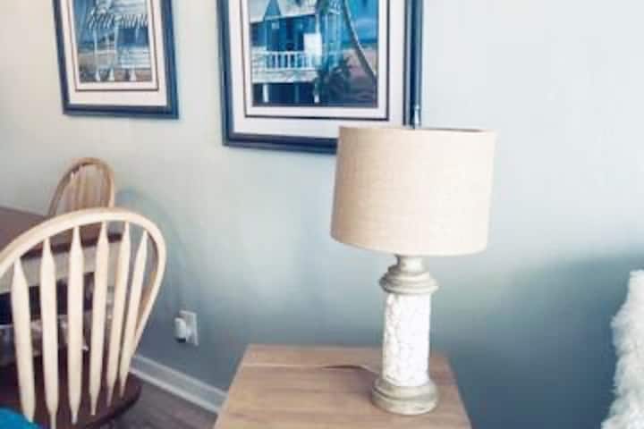 Side table with USB ports and three prong outlets.  For your remote working needs ..