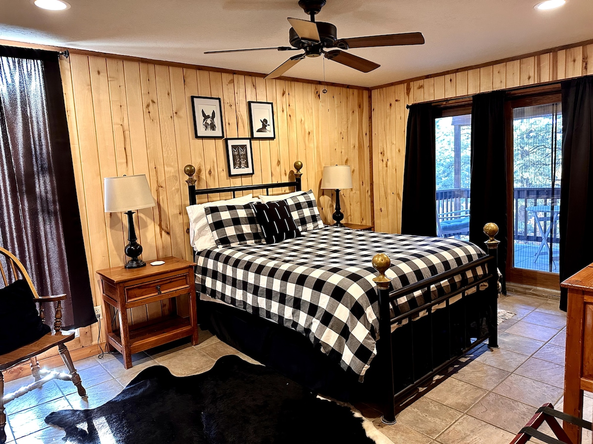 Bedroom 1 - on main floor, features on on-suite bathroom, and private deck. The cowboy room!