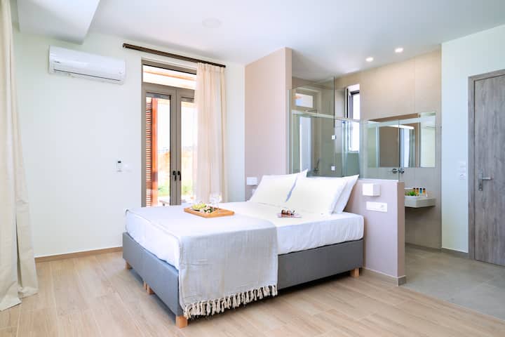 ห้องนอนที่มีสไตล์พร้อมห้องน้ำในตัว
