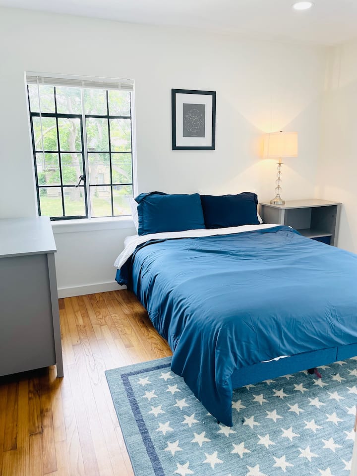 Next to the larger bedroom with a king bed is this medium-sized bedroom with a queen bed.