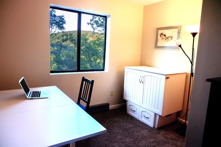 A great place to get a little work done... The small bedroom made up as a study. (Laptop not included.)