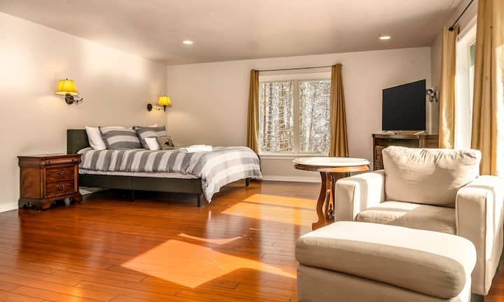 Huge master suite with comfy bed. Relax in king bed and enjoy the 55" TV and mt views