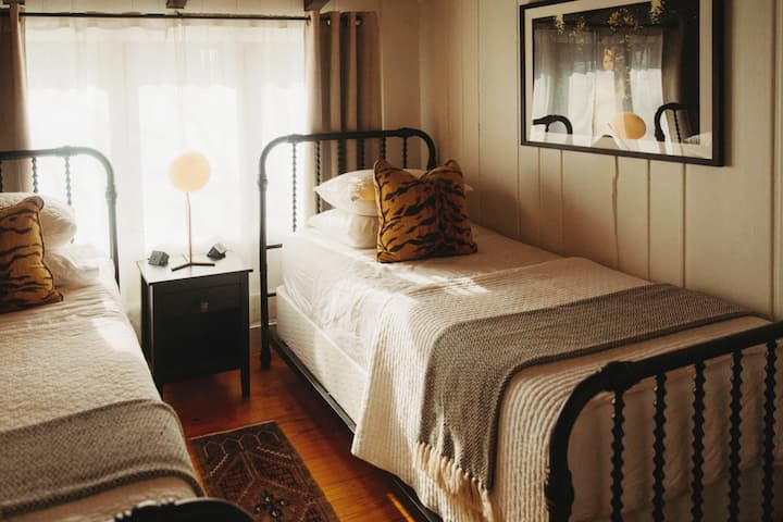 Second bedroom with Nectar mattresses, quality pillows and linens and light dimming curtains. 

Photo by Rainstorm Photo