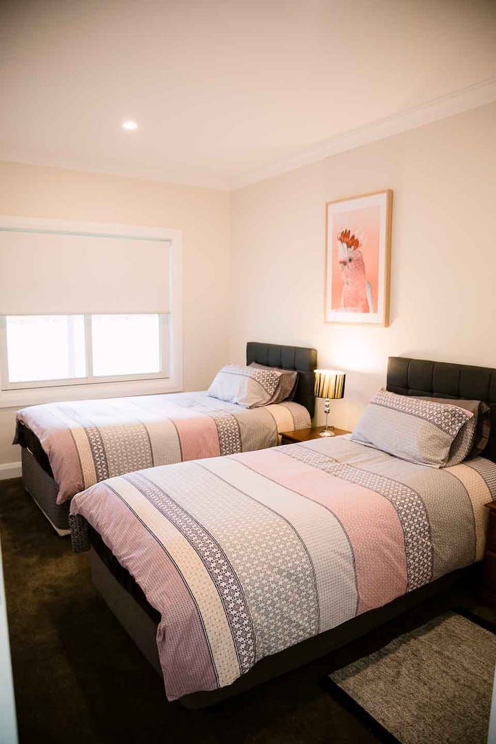 Twin room with King single beds. This room has widen doorway to accommodate wheel chairs and located across from the bathroom