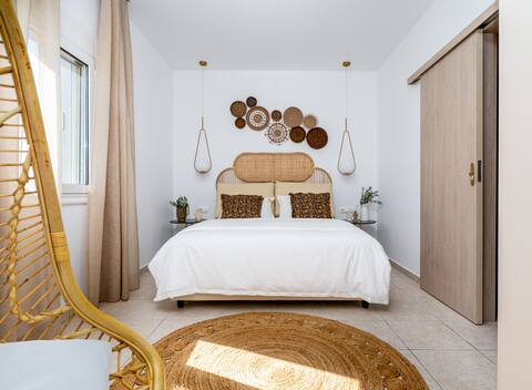 Beachy Chic apartment footsteps from the sand