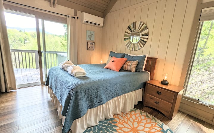 Secondary Bedroom Suite: Spacious room with high ceilings and private door to rear deck. We love how each bedroom has mountain views. 

Each bedroom has state of the art mini-split, which easily allows you to heat and cool as needed.