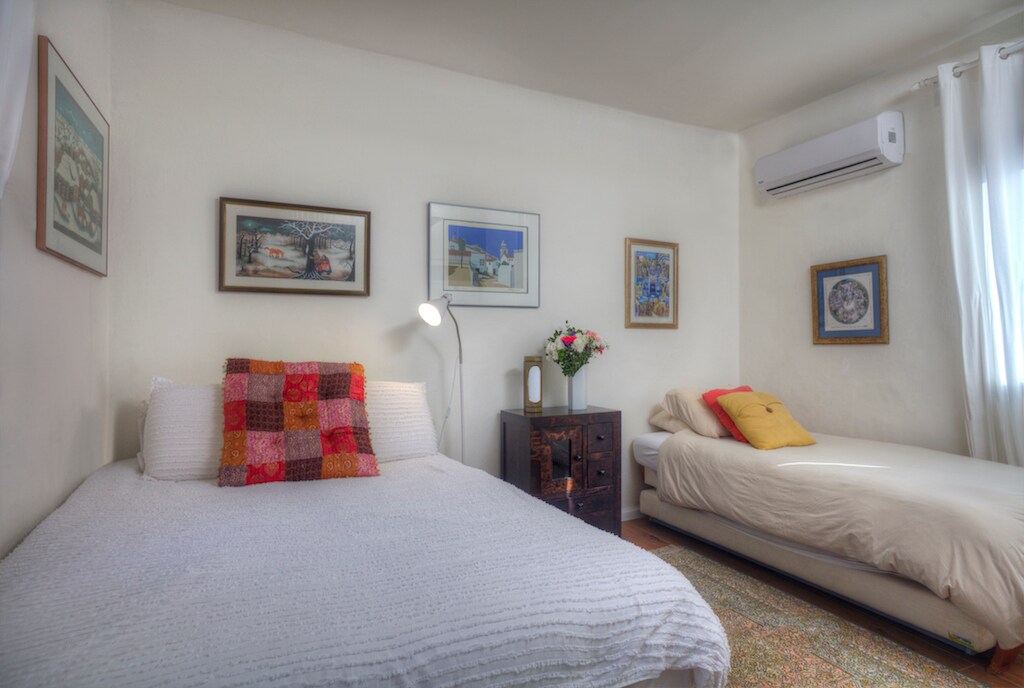 This bedroom is located upstairs and features a double bed plus a single that has a pullout. The room can sleep up to four. There is an adjacent bathroom with shower. This room also has a washer and dryer. 