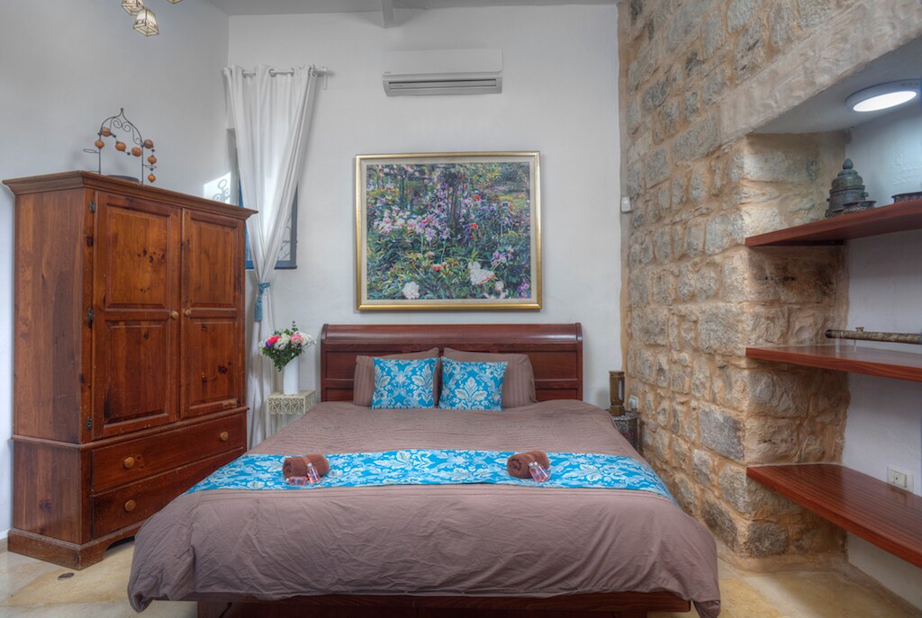 This bedroom is located in the main house. It features a king size bed that can be made up as two singles. Bathroom with shower is next to the room.  