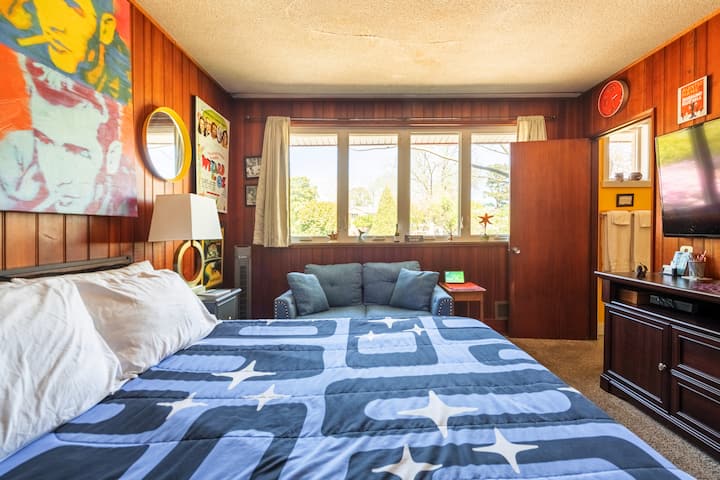 Guest Room 2 offers a queen bed, dresser, closet and smart TV.