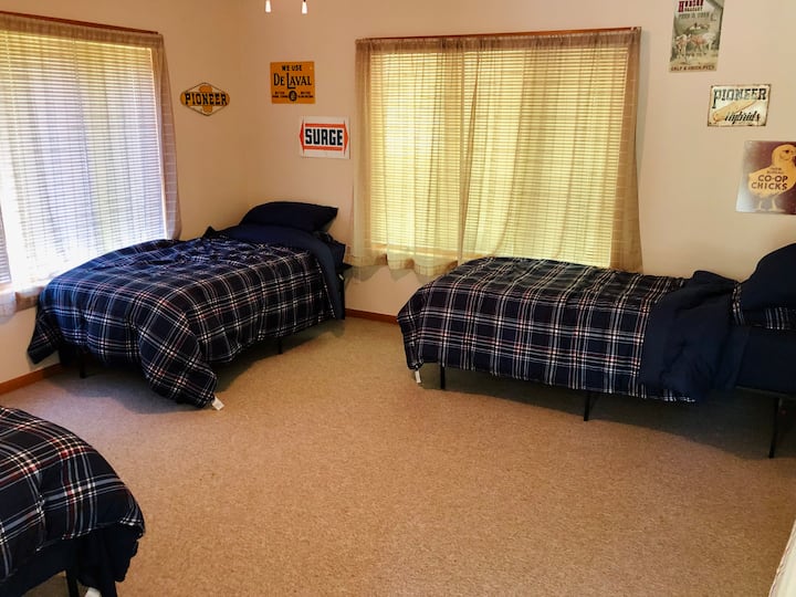 Three single beds are available in the sunroom. Blinds are provided for privacy and shade. This would be considered a common space, there is a curtain between this room and the living room. 